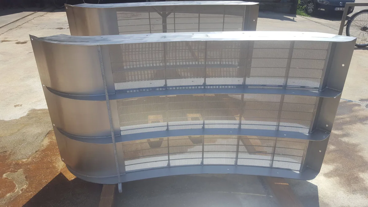 A finished Coanda intake screen unit standing outdoors, seen from three-quarters