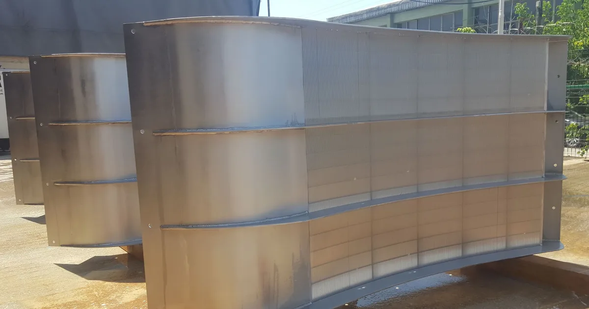 A finished Coanda intake screen unit standing outdoors, seen from three-quarters