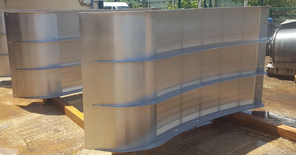 A finished Coanda intake screen unit standing outdoors, seen from three-quarters