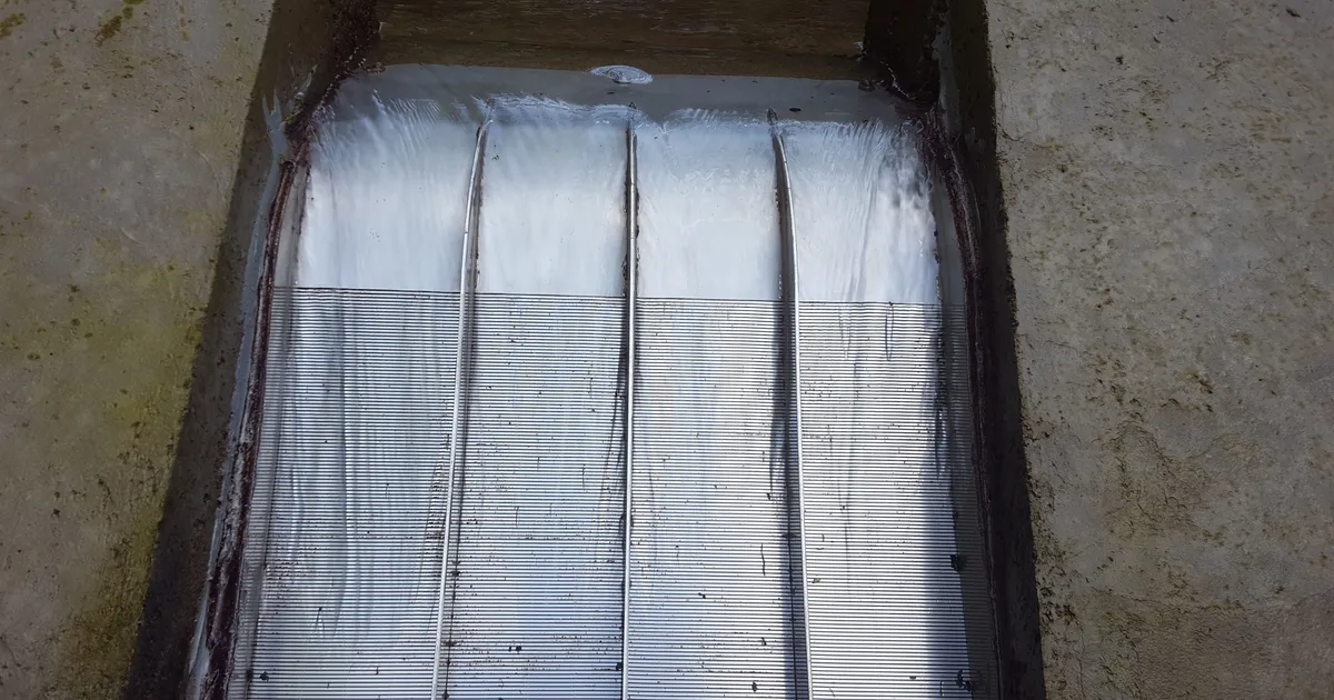 A Coanda intake screen in service, clear water passing evenly across the whole screen face